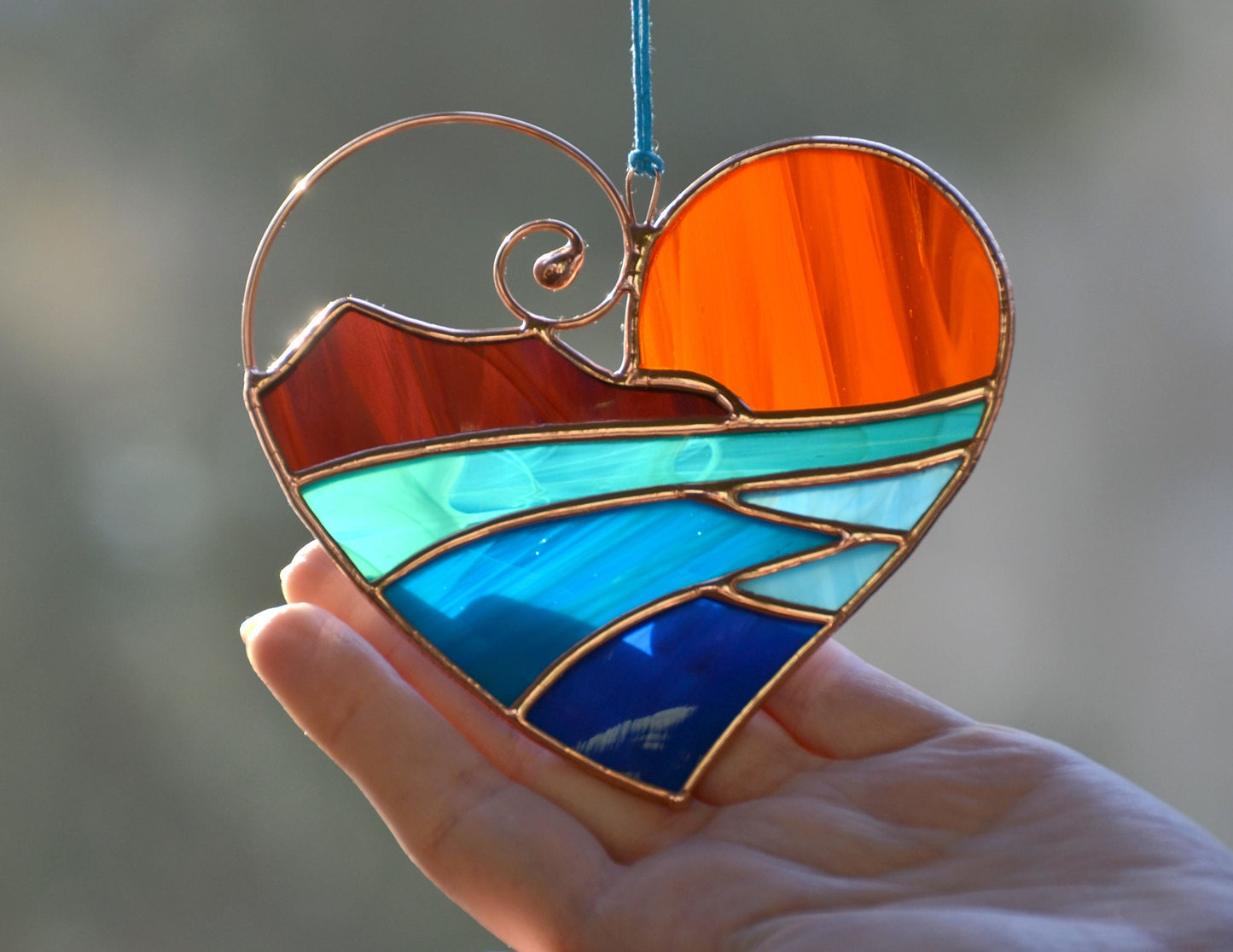 Handmade stained glass heart suncatcher with ocean sunset design
