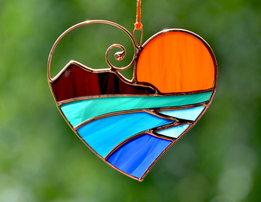 Handmade stained glass heart suncatcher with ocean sunset design